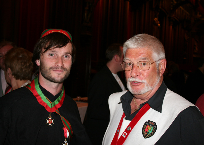 A member of the St Michael's Student Association with a member of the Order of the Faro.